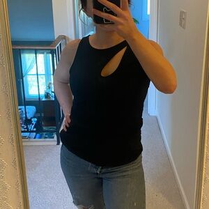 Black tank with asymmetrical cross straps and keyhole